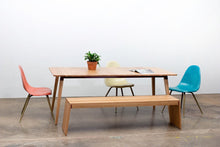 Load image into Gallery viewer, Minimalist Modern Dining Table with Angled Legs. Handmade of Solid Wood and Powder Coated Metal. Available in Walnut, Oak or Ash with Oval or Rectangular Top. Custom Paint Colors Available.