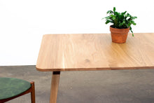Load image into Gallery viewer, Minimalist Modern Dining Table with Angled Legs. Handmade of Solid Wood and Powder Coated Metal. Available in Walnut, Oak or Ash with Oval or Rectangular Top. Custom Paint Colors Available.