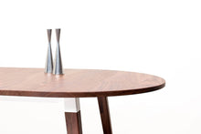Load image into Gallery viewer, Minimalist Modern Dining Table with Angled Legs. Handmade of Solid Wood and Powder Coated Metal. Available in Walnut, Oak or Ash with Oval or Rectangular Top. Custom Paint Colors Available.
